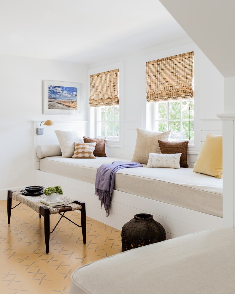 Inspiration for a coastal multicolored floor family room remodel with white walls