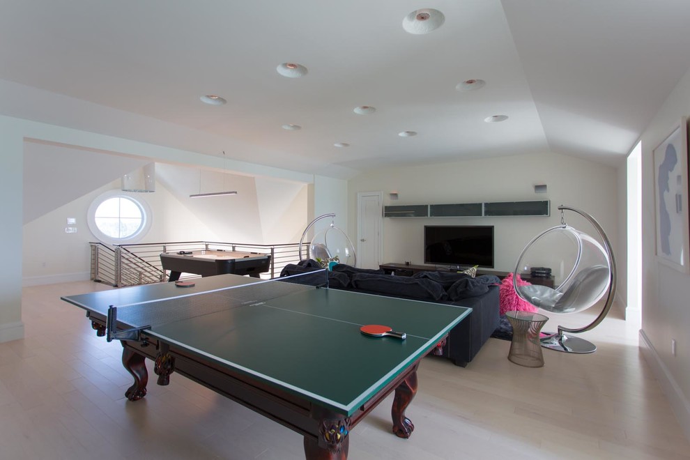 This is an example of a contemporary games room in Other with a game room.