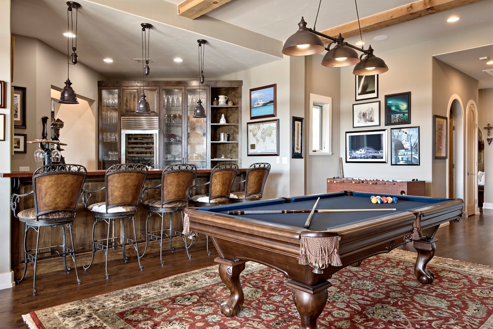 This is an example of a medium sized rustic games room in Austin with grey walls, medium hardwood flooring and feature lighting.