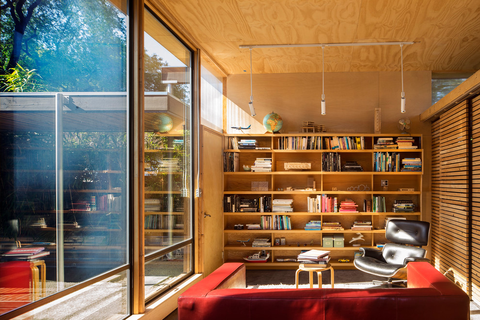 Ispirazione per un piccolo soggiorno design con nessun camino, libreria e nessuna TV