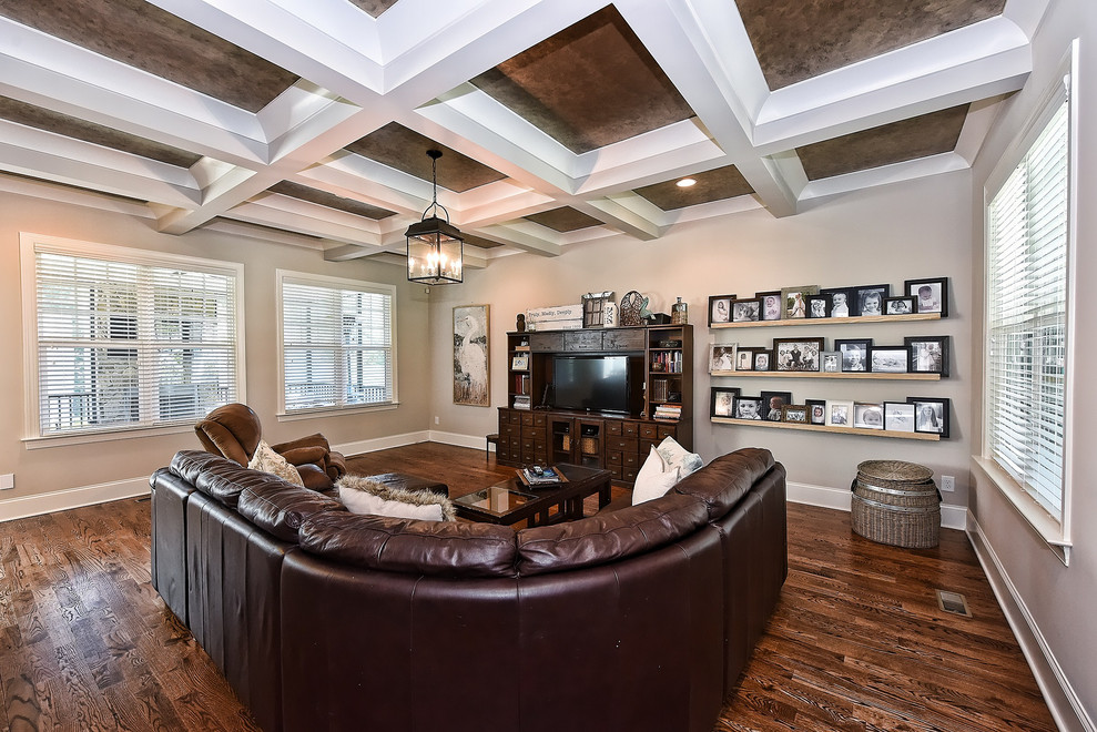Photo of a medium sized country games room in Other with brown walls, dark hardwood flooring, no fireplace, a freestanding tv and brown floors.