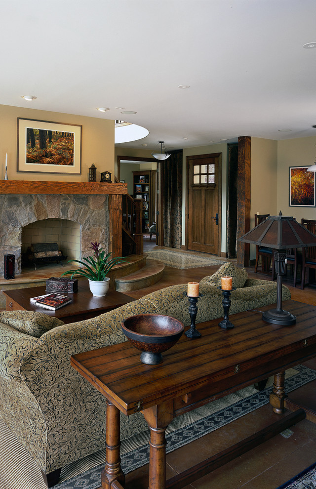 Large elegant open concept concrete floor and brown floor family room photo in Chicago with beige walls, a standard fireplace and a stone fireplace