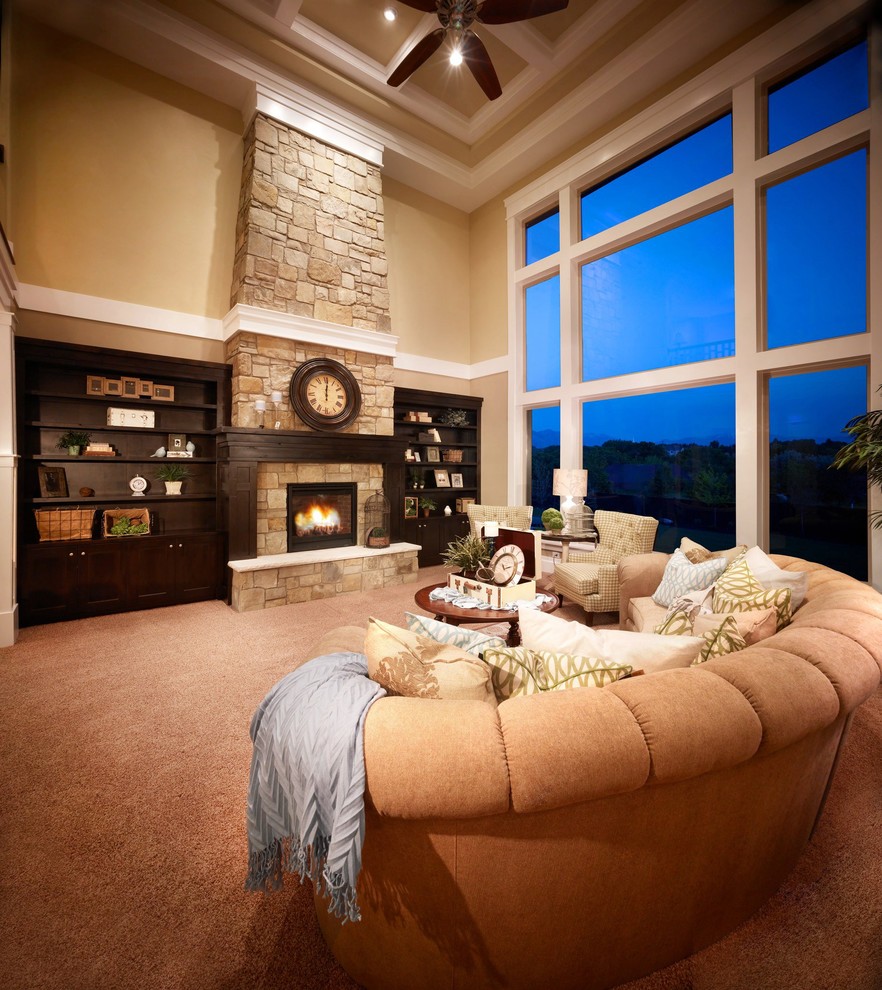 Ejemplo de sala de estar abierta clásica grande sin televisor con paredes beige, moqueta, todas las chimeneas, marco de chimenea de piedra, suelo marrón y alfombra