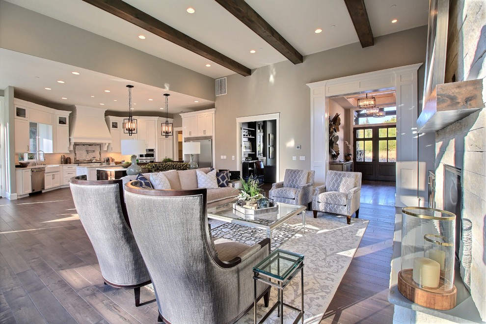 Example of a huge transitional open concept dark wood floor family room design in Portland with a bar, gray walls, a standard fireplace, a stone fireplace and no tv