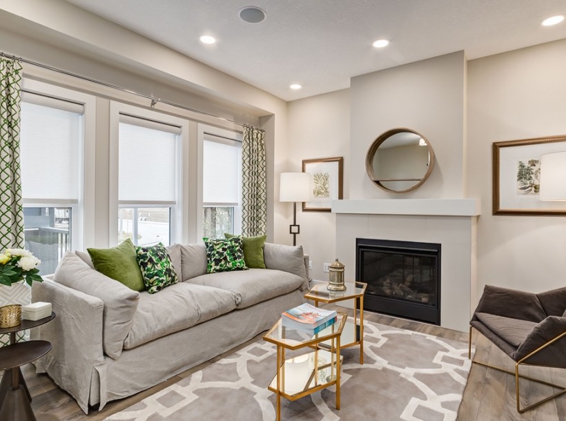 Medium sized contemporary open plan games room in Calgary with a standard fireplace and grey floors.