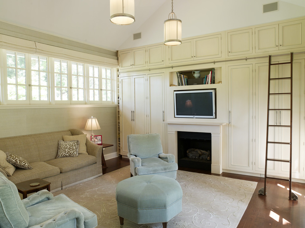 Trendy family room photo in New York with beige walls, a standard fireplace and a media wall