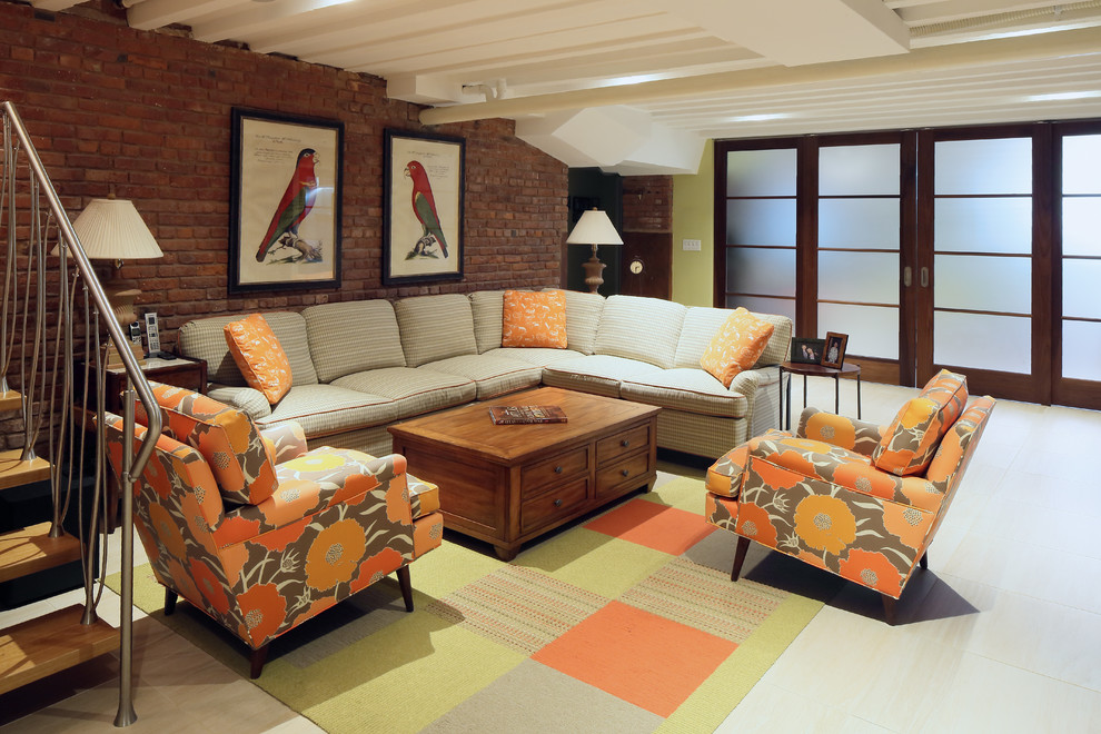 Idee per un grande soggiorno bohémian stile loft con pareti verdi, pavimento in gres porcellanato e TV a parete