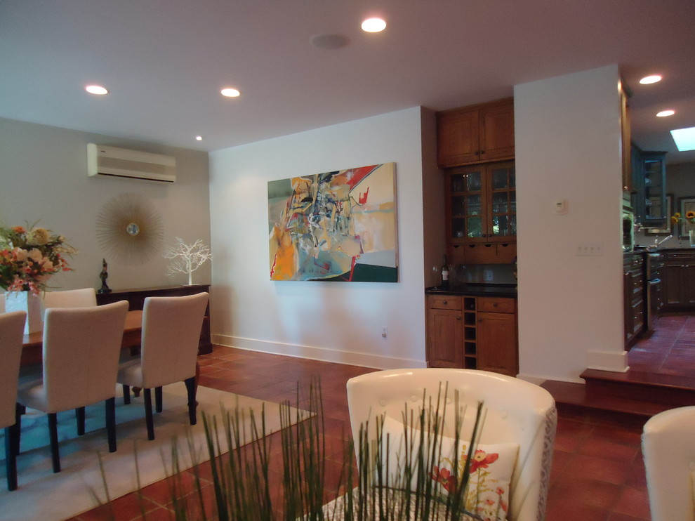 Example of a huge trendy open concept terra-cotta tile family room design in Toronto with beige walls