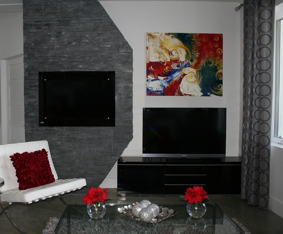 Example of a mid-sized trendy open concept concrete floor and gray floor family room design in Ottawa with white walls, a hanging fireplace, a stone fireplace and a tv stand