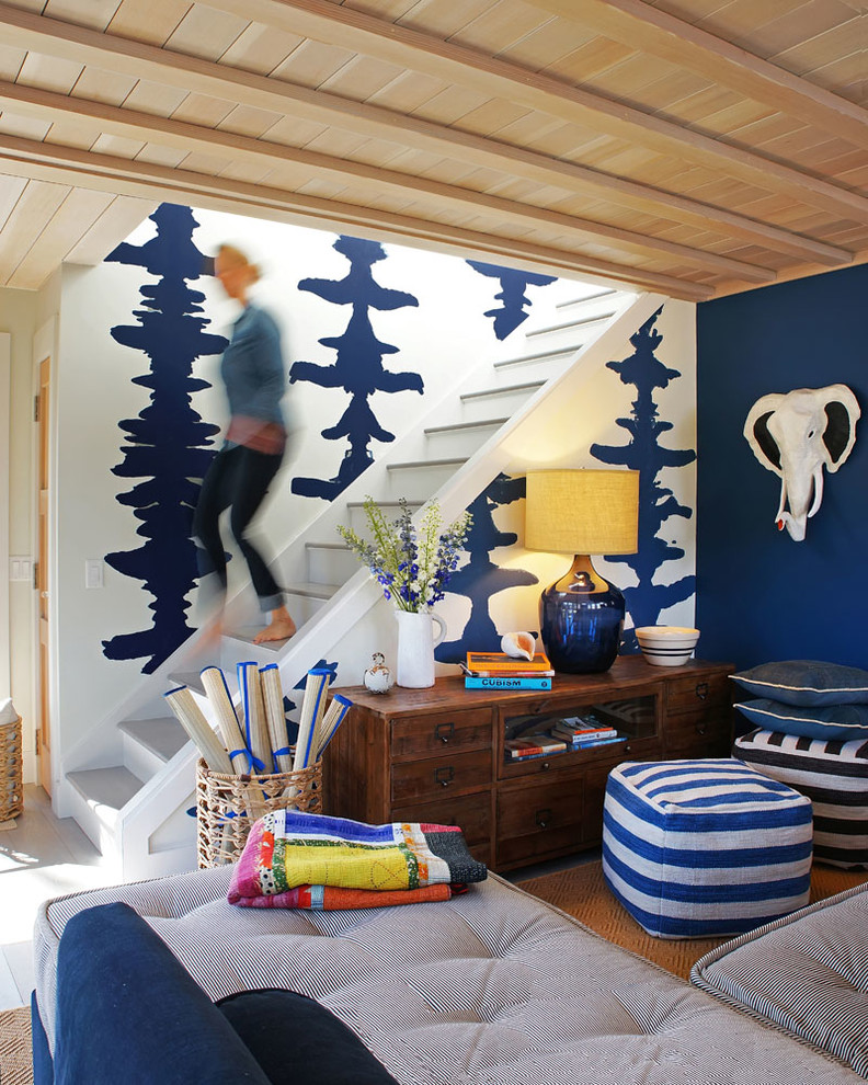 Family room library - mid-sized contemporary enclosed light wood floor and beige floor family room library idea in Boston with blue walls