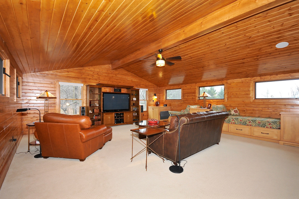 Photo of a large classic mezzanine games room in Indianapolis with brown walls, carpet and a built-in media unit.