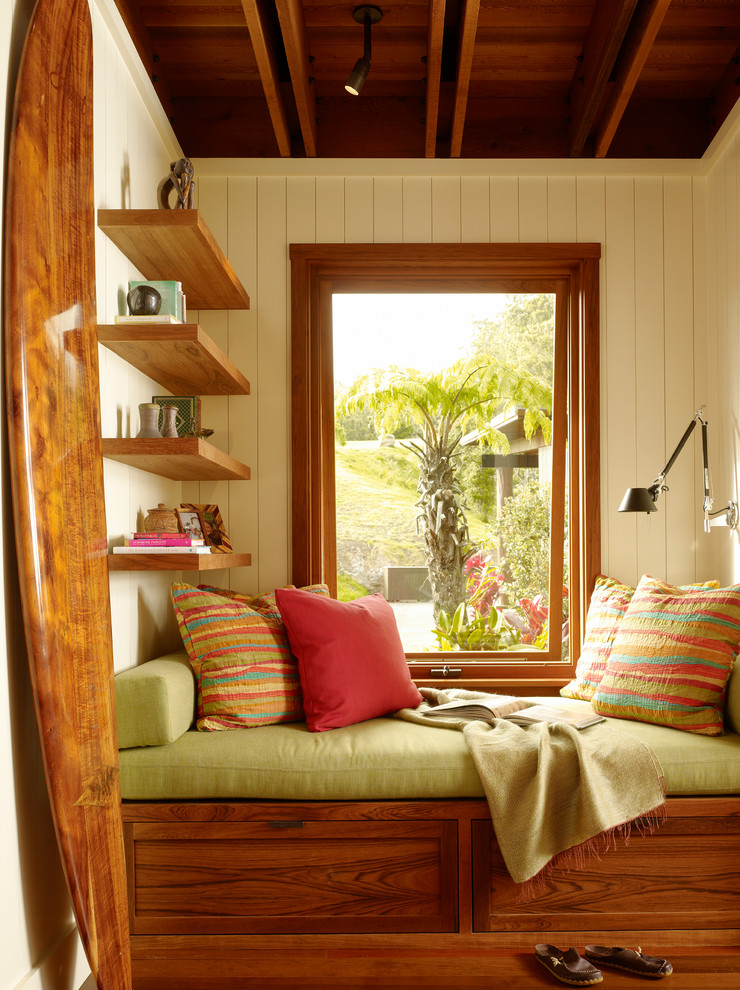 Family room - tropical medium tone wood floor family room idea in Hawaii with beige walls