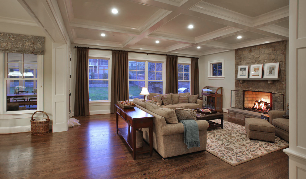 Mid-sized elegant open concept dark wood floor and brown floor family room photo in DC Metro with white walls, a standard fireplace, a stone fireplace and no tv