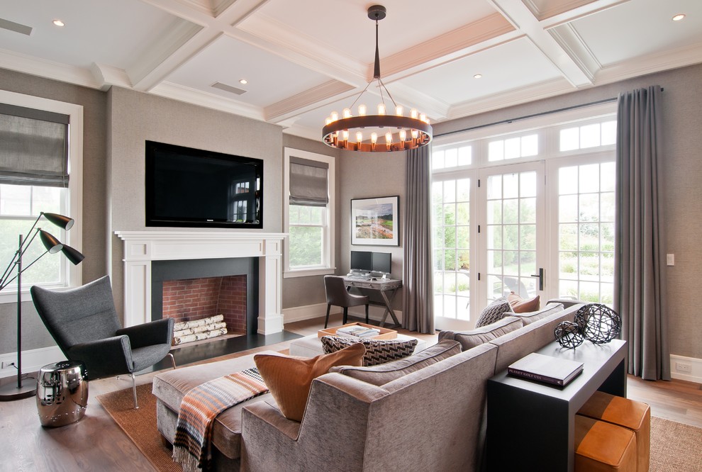 Family room - transitional family room idea in New York with gray walls, a standard fireplace and a wall-mounted tv