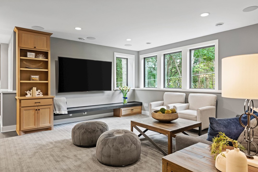 Mid-sized transitional open concept carpeted and gray floor family room photo in Minneapolis with gray walls, no fireplace and a wall-mounted tv