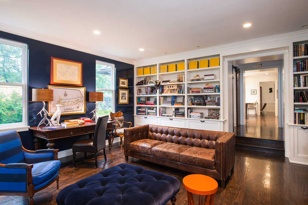 This is an example of a contemporary games room in Philadelphia with a reading nook, black walls and dark hardwood flooring.