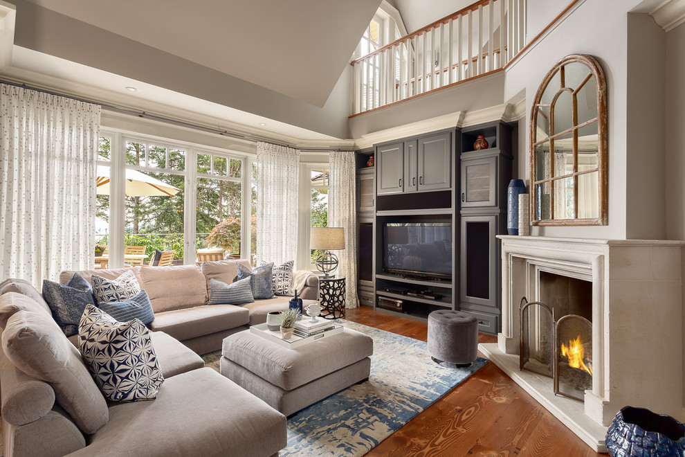 Inspiration for a mid-sized craftsman open concept medium tone wood floor and brown floor family room remodel in Vancouver with beige walls, a standard fireplace, a concrete fireplace and a media wall