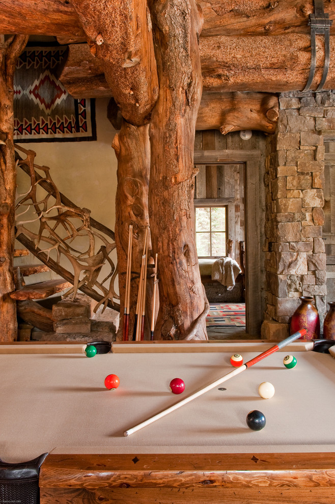 Photo of a rustic games room in Other with beige walls.