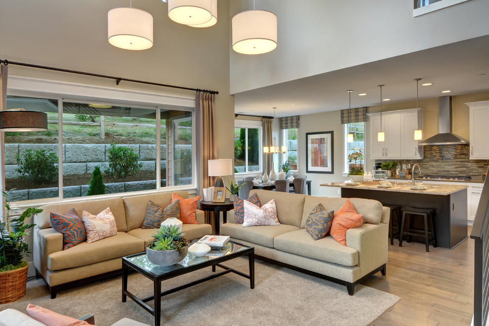 Family room - transitional open concept medium tone wood floor family room idea in Seattle with gray walls and a wall-mounted tv