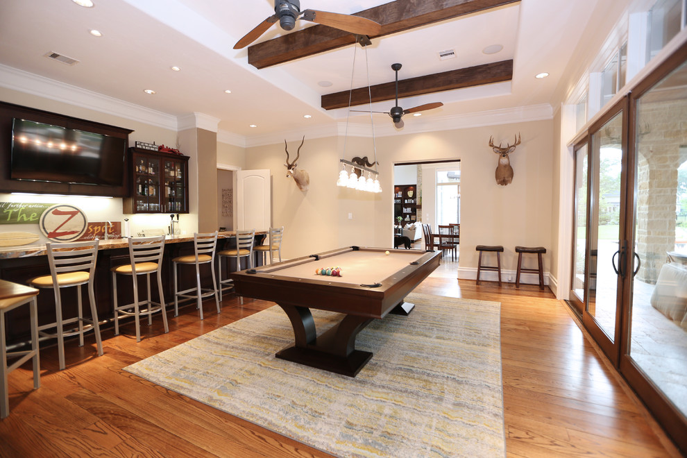 Inspiration for a large contemporary enclosed games room in Houston with a game room, medium hardwood flooring and a built-in media unit.