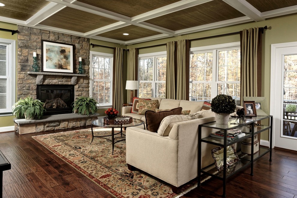 Inspiration for a large traditional open plan games room in DC Metro with green walls, medium hardwood flooring, a ribbon fireplace, a stone fireplace surround, a wall mounted tv and brown floors.