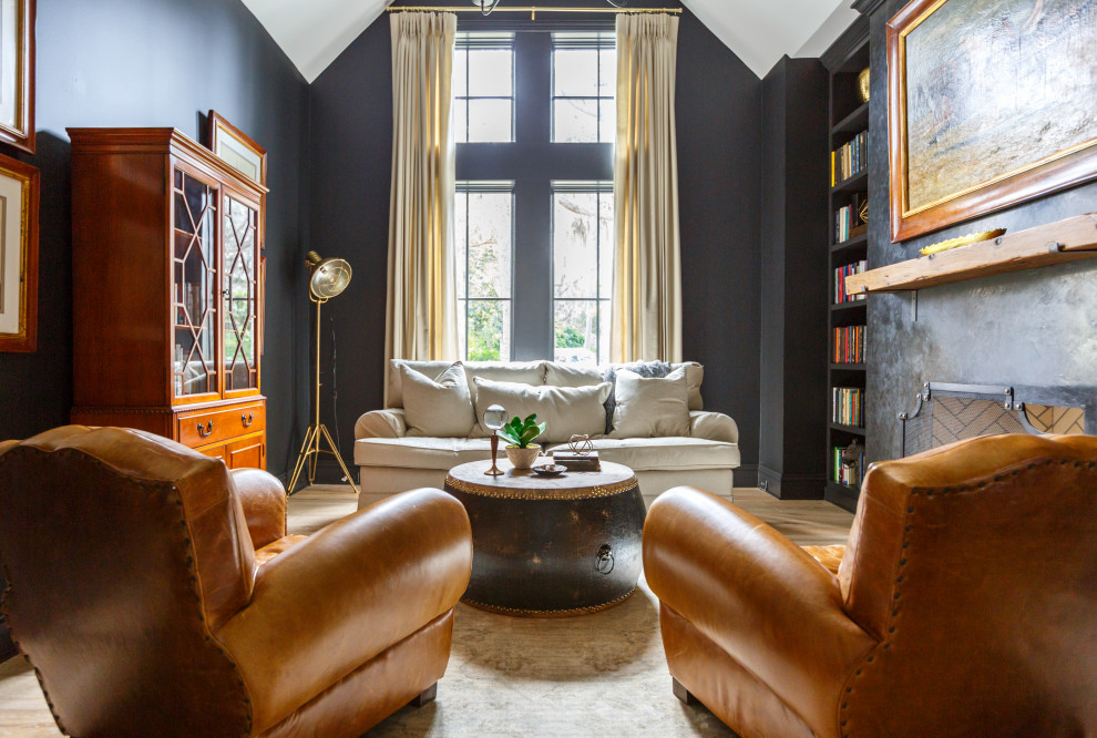 На фото: гостиная комната в стиле неоклассика (современная классика) с с книжными шкафами и полками, серыми стенами, фасадом камина из кирпича и сводчатым потолком без камина, телевизора с