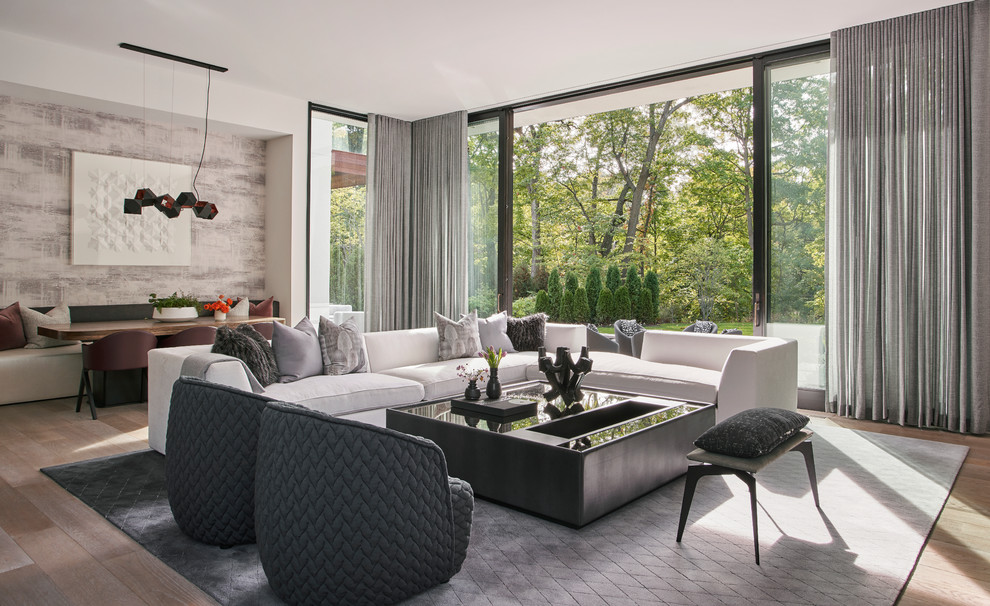 Photo of a contemporary games room in Chicago with white walls, medium hardwood flooring, brown floors and a feature wall.