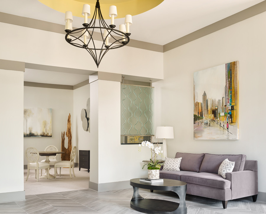 На фото: огромная открытая гостиная комната в стиле модернизм с серыми стенами, полом из керамогранита и отдельно стоящим телевизором без камина