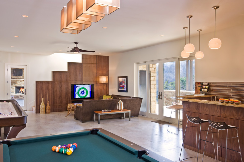 Photo of a contemporary open plan games room in Austin with beige walls and a built-in media unit.