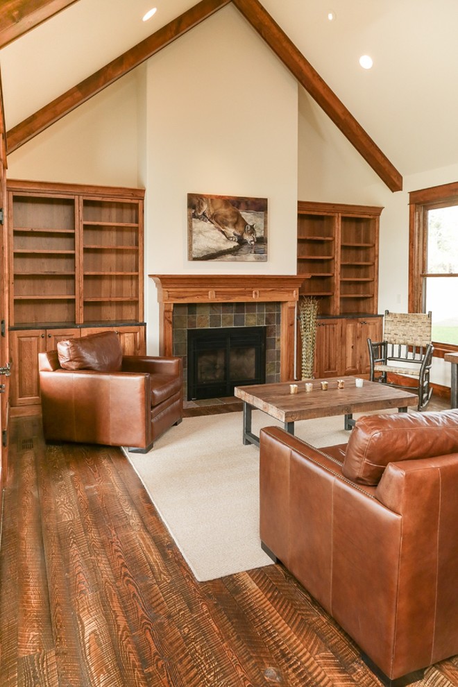 Inspiration for a mid-sized craftsman open concept dark wood floor and brown floor family room remodel in Other with white walls, a standard fireplace, a tile fireplace and no tv