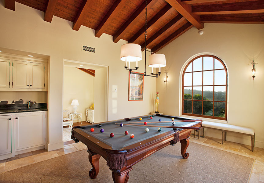 Example of a mid-sized tuscan enclosed porcelain tile game room design in Santa Barbara with no tv, yellow walls and no fireplace