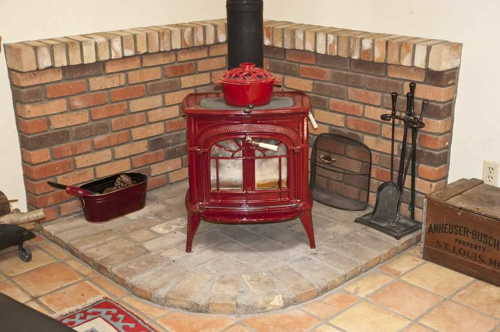 Modern Wood Burning Stove with Accessories and Red Gloves Next To it. Wood  Burning Stove with Orange Yellow Flames Stock Photo - Image of glowing,  home: 199860238