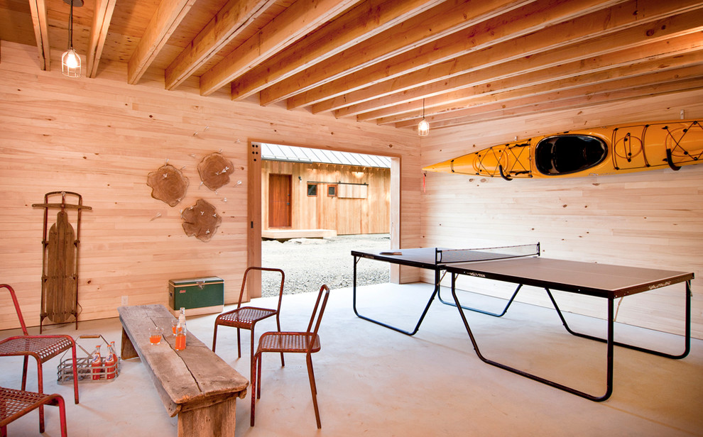 Photo of a rustic enclosed games room in New York with a game room.