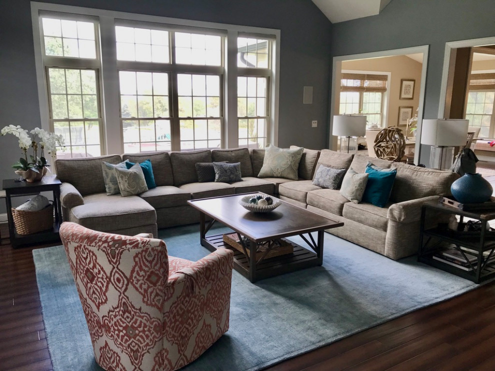 Large transitional open concept medium tone wood floor and brown floor family room photo in Philadelphia with gray walls, no fireplace and a wall-mounted tv