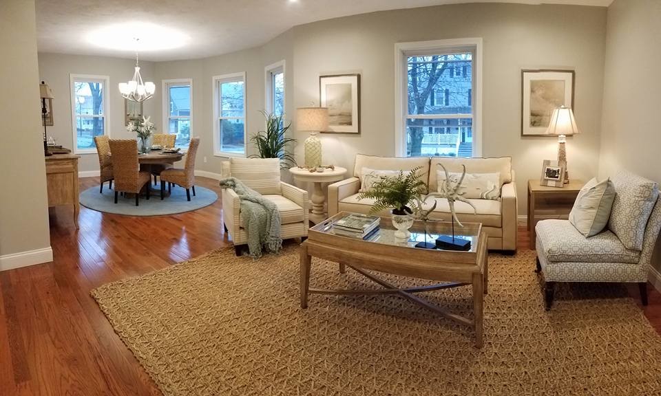 Mid-sized beach style open concept light wood floor and brown floor family room photo in Boston with white walls, no fireplace and no tv