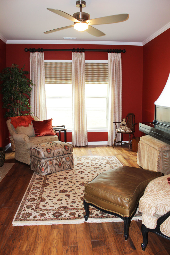 Exemple d'une salle de séjour chic ouverte avec un sol en bois brun, une cheminée standard et un manteau de cheminée en bois.