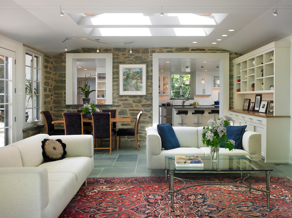 Family room - mid-sized eclectic open concept slate floor family room idea in Philadelphia with white walls