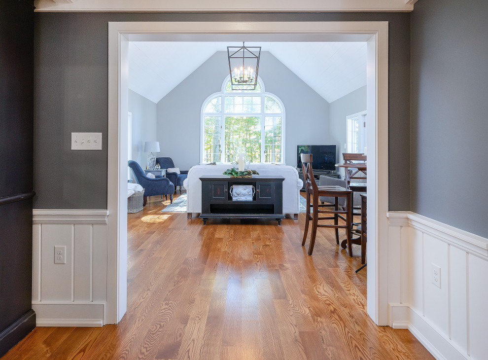 Example of a large cottage enclosed medium tone wood floor, brown floor and shiplap ceiling family room design in Philadelphia with gray walls