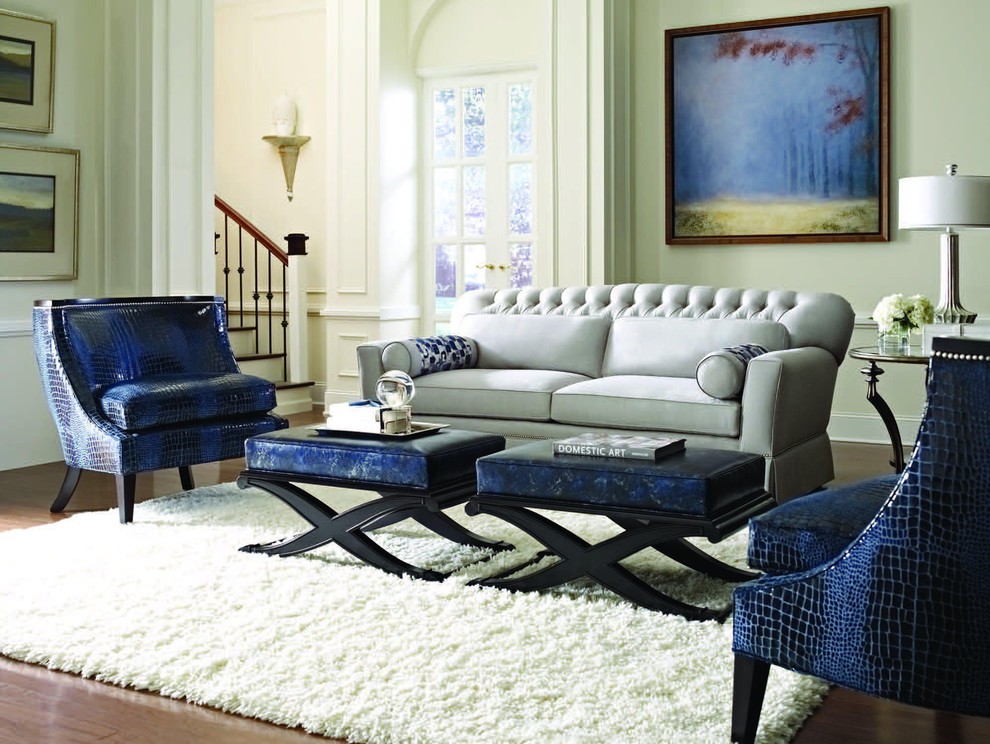Example of a trendy dark wood floor family room design in Austin with beige walls
