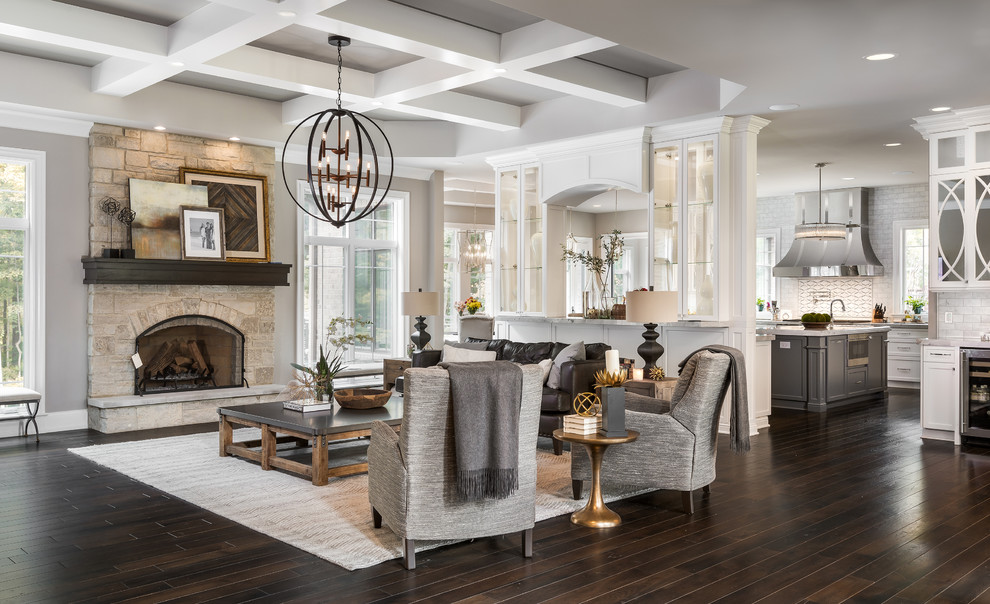 Inspiration for a large transitional open concept dark wood floor family room remodel in Chicago with gray walls, a standard fireplace, a stone fireplace and a tv stand
