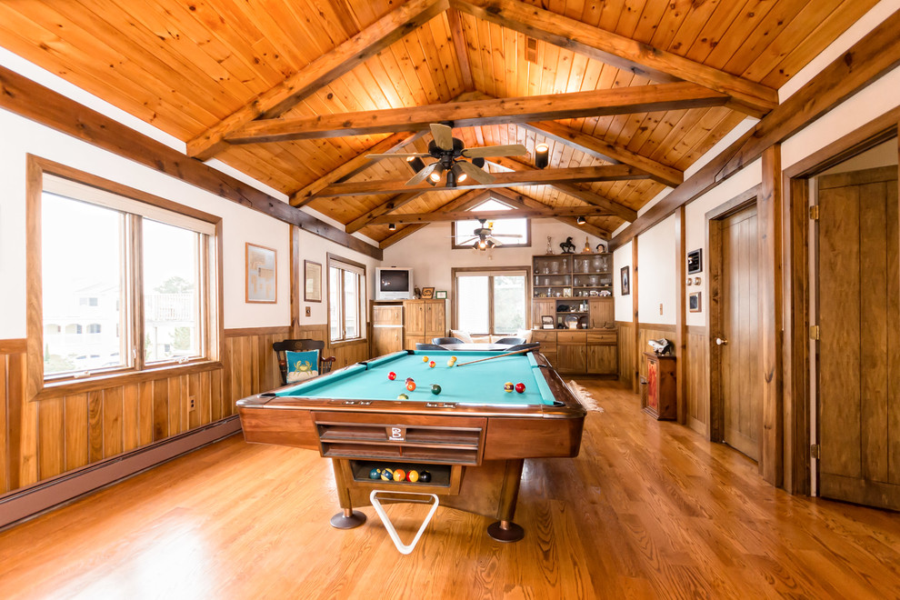 Inspiration for a rustic games room in Other with beige walls and medium hardwood flooring.