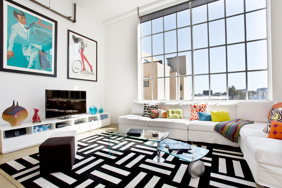 Design ideas for an urban games room in San Francisco with white walls, no fireplace and a freestanding tv.