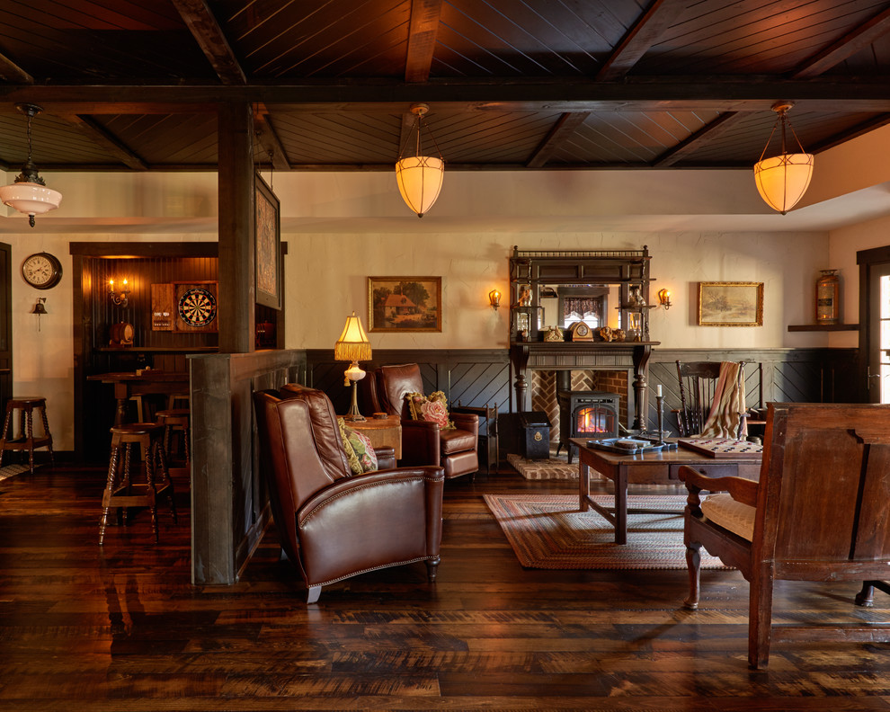 Inspiration for a mid-sized rustic dark wood floor family room remodel in Charlotte