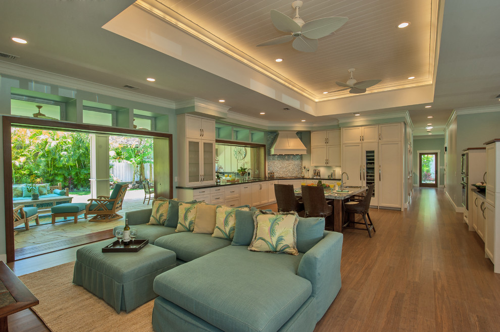 Example of a mid-sized transitional open concept bamboo floor family room design in Hawaii