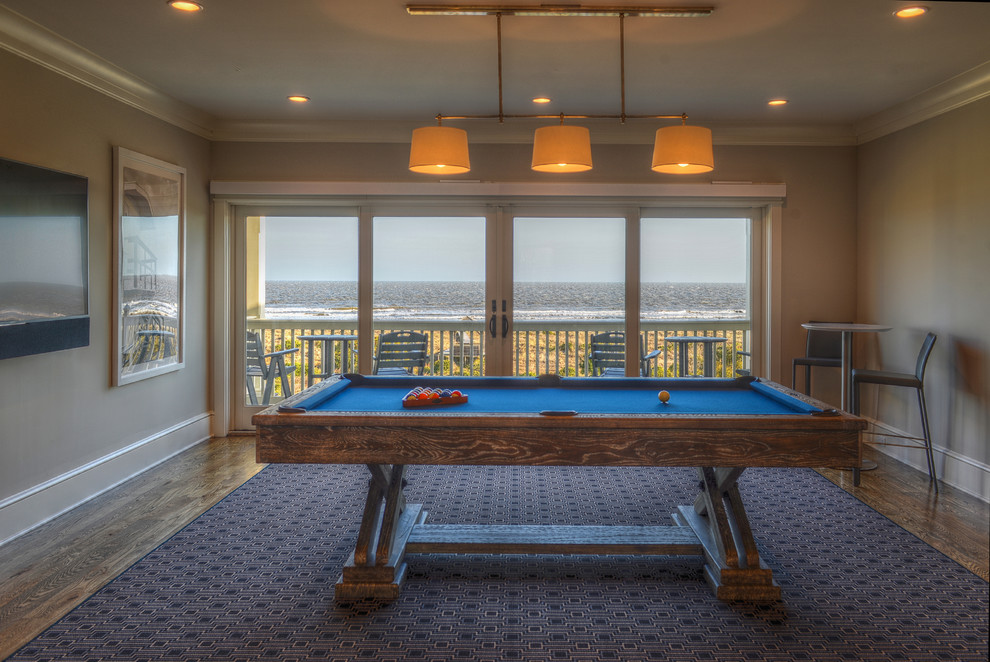 Design ideas for a medium sized coastal enclosed games room in Charleston with a game room, white walls, medium hardwood flooring and a wall mounted tv.