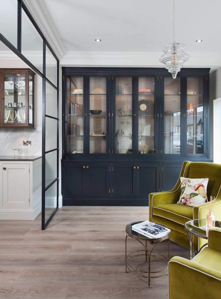Mid-sized transitional open concept light wood floor and beige floor family room photo in Dublin with no tv