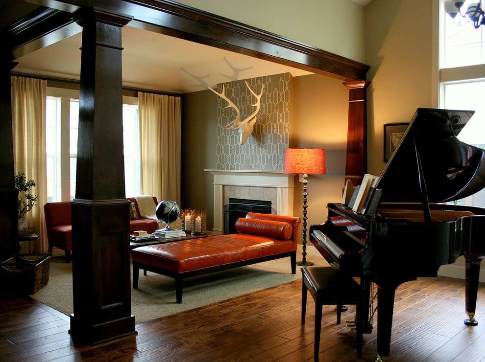 Elegant open concept medium tone wood floor family room photo in Portland with a music area, beige walls, a standard fireplace and no tv