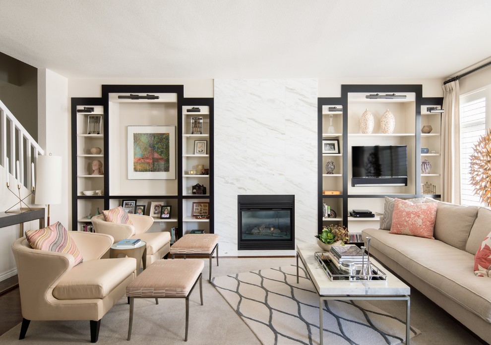 This is an example of a medium sized classic open plan games room in Denver with beige walls, a standard fireplace, a built-in media unit and a stone fireplace surround.