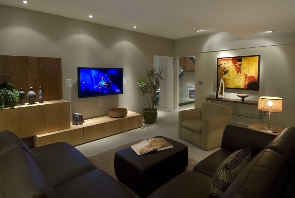 Large modern enclosed games room in Hawaii with grey walls, no fireplace, a wall mounted tv and beige floors.