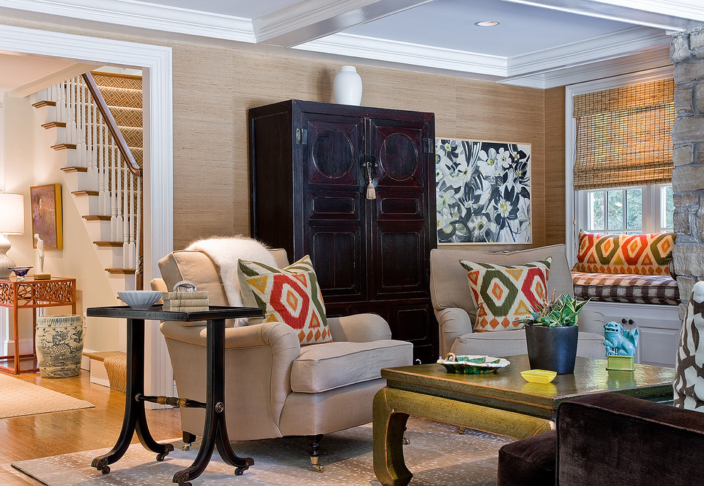 Example of a transitional medium tone wood floor family room design in Boston with beige walls
